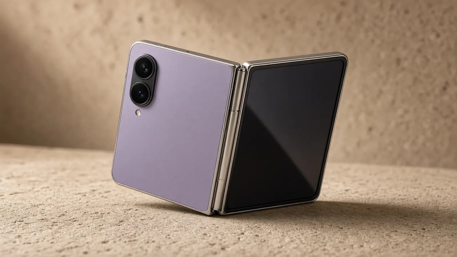 Short, wide lavender foldable phone standing half open on a warm beige stone surface